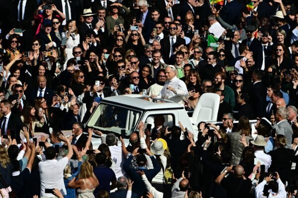 Pope Leo XIV travels St. Peter's Square in Popemobile before the inaugural Mass